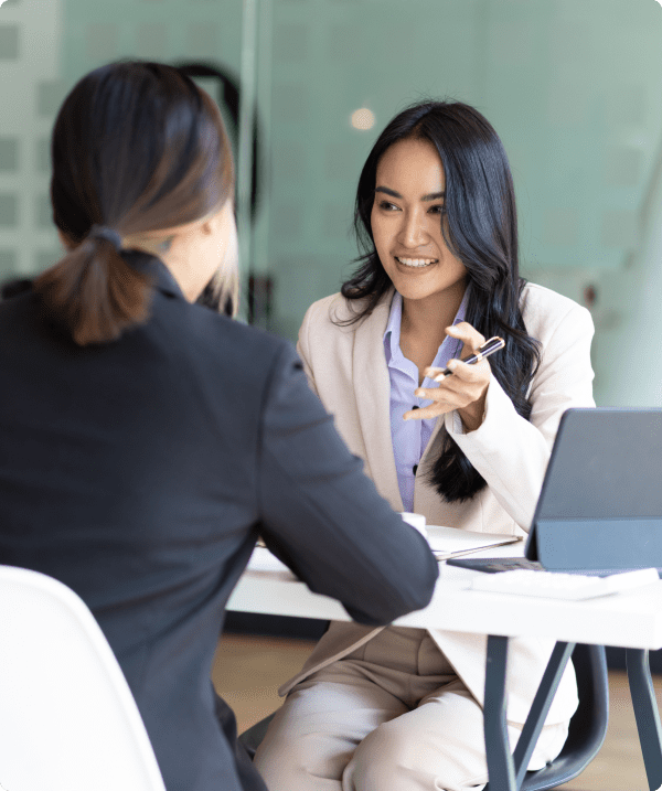 Two women in business meeting, smiling
