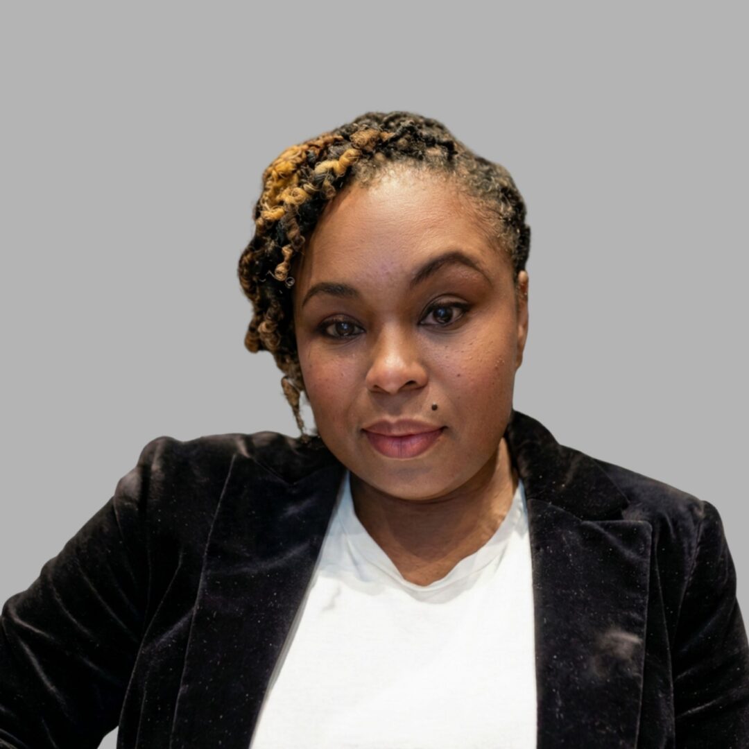 Portrait of person with braided hair, blazer
